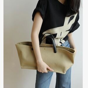 Elegant east west Tan Tote Bag with Black Handles